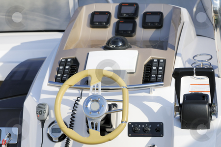 To use this stock image in your creative project, please select the size you need over to the right and click the "Add to Cart" button.
Your downloaded image will come with the Cutcaster watermark removed so don’t worry about the watermark you see on this page. Motorboat cockpit stock photo, Instruments panel and steering wheel of a motorboat by Massimiliano Leban