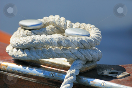 To use this stock image in your creative project, please select the size you need over to the right and click the "Add to Cart" button.
Your downloaded image will come with the Cutcaster watermark removed so don’t worry about the watermark you see on this page. Moored boat stock photo, Close-up of a rope tied-up on a bitt fasten a boat to dock by Massimiliano Leban