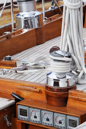 To use this stock image in your creative project, please select the size you need over to the right and click the "Add to Cart" button.
Your downloaded image will come with the Cutcaster watermark removed so don’t worry about the watermark you see on this page. Sailboat detail stock photo, Detail of a wooden boat with tools and navigation instruments by Massimiliano Leban