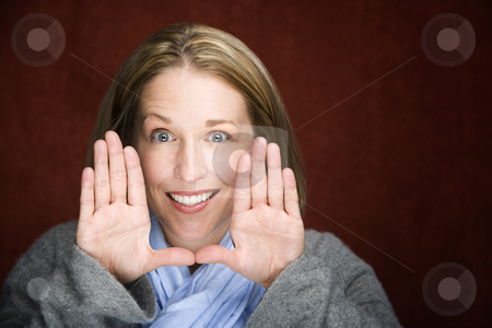 To use this stock image in your creative project, please select the size you need over to the right and click the "Add to Cart" button.
Your downloaded image will come with the Cutcaster watermark removed so don’t worry about the watermark you see on this page. Pretty woman framing her face stock photo, Pretty woman framing her face with her hands by Scott Griessel