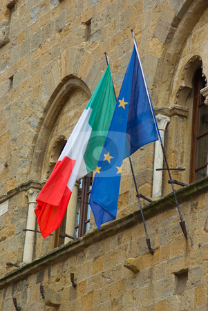 To use this stock image in your creative project, please select the size you need over to the right and click the "Add to Cart" button.
Your downloaded image will come with the Cutcaster watermark removed so don’t worry about the watermark you see on this page. Italien/Europa Fahne - Flag of Italy/Europe stock photo, An einem Haus in Volterra. Toskana - On a house at volterra, tuscany by Wolfgang Heidasch