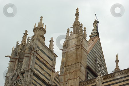 To use this stock image in your creative project, please select the size you need over to the right and click the "Add to Cart" button.
Your downloaded image will come with the Cutcaster watermark removed so don’t worry about the watermark you see on this page. Der Dom von Siena (ital. Cattedrale di Santa Maria Assunta) - The Cathedral of Siena (Italian: Duomo stock photo, Der Dom von Siena (ital. Cattedrale di Santa Maria Assunta) ist die Hauptkirche der Stadt Siena in der Toskana. - The medieval Cathedral of Siena (Italian: Duomo di Siena), dedicated from its earliest days as a Roman Catholic Marian church and now to Santa Maria Assunta (Most Holy Mary of Assumption), is the seat of the Archbishop of Siena-Colle di Val d'Elsa-Montalcino. by Wolfgang Heidasch