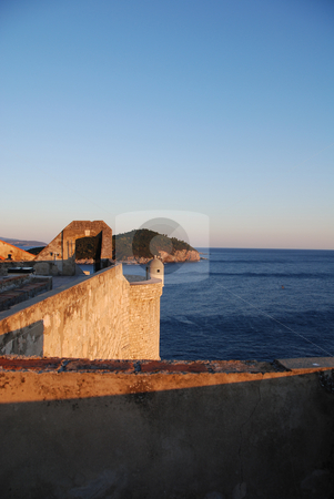 To use this stock image in your creative project, please select the size you need over to the right and click the "Add to Cart" button.
Your downloaded image will come with the Cutcaster watermark removed so don’t worry about the watermark you see on this page. Dubrovnik Old Town Wall at Sunset stock photo, Old Town Wall overlooking Adriatic in Dubrovnik, Croatia by Jodi Baglien Sparkes