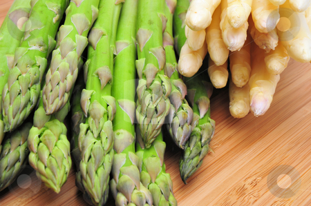To use this stock image in your creative project, please select the size you need over to the right and click the "Add to Cart" button.
Your downloaded image will come with the Cutcaster watermark removed so don’t worry about the watermark you see on this page. Fresh Asparagus stock photo, Green and white Asparagus on a Bamboo cutting board by Lynn Bendickson