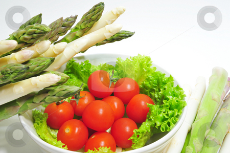 To use this stock image in your creative project, please select the size you need over to the right and click the "Add to Cart" button.
Your downloaded image will come with the Cutcaster watermark removed so don’t worry about the watermark you see on this page. Aparagus And Tomatoes stock photo, Cherry tomatoes in a bowl with asparagus on the side by Lynn Bendickson