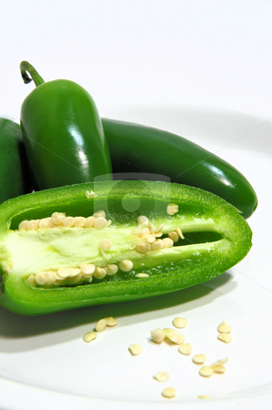 To use this stock image in your creative project, please select the size you need over to the right and click the "Add to Cart" button.
Your downloaded image will come with the Cutcaster watermark removed so don’t worry about the watermark you see on this page. Jalapeno Pepper And Seeds stock photo, Sliced and whole chili peppers with seeds exposed on a white saucer by Lynn Bendickson