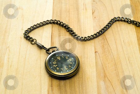 To use this stock image in your creative project, please select the size you need over to the right and click the "Add to Cart" button.
Your downloaded image will come with the Cutcaster watermark removed so don’t worry about the watermark you see on this page. Antique Pocket Watch stock photo, An antique pocket watch shot on a wooden table by Richard Nelson
