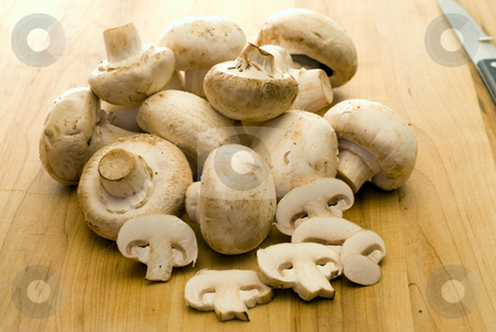 To use this stock image in your creative project, please select the size you need over to the right and click the "Add to Cart" button.
Your downloaded image will come with the Cutcaster watermark removed so don’t worry about the watermark you see on this page. Sliced Mushrooms stock photo, A pile of mushrooms with some sliced by Richard Nelson
