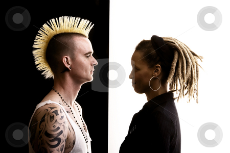 To use this stock image in your creative project, please select the size you need over to the right and click the "Add to Cart" button.
Your downloaded image will come with the Cutcaster watermark removed so don’t worry about the watermark you see on this page. Man with Mohawk and Woman with Dreadlocks stock photo, Caucasian Man with Mohawk and African-American Woman with Dreadlocks by Scott Griessel