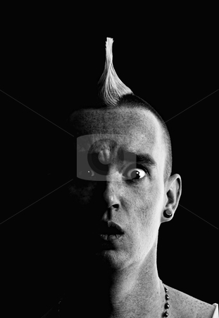 To use this stock image in your creative project, please select the size you need over to the right and click the "Add to Cart" button.
Your downloaded image will come with the Cutcaster watermark removed so don’t worry about the watermark you see on this page. Man with Mohawk stock photo, Confused Man with a Tall Pointed Mohawk by Scott Griessel