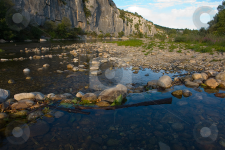 To use this stock image in your creative project, please select the size you need over to the right and click the "Add to Cart" button.
Your downloaded image will come with the Cutcaster watermark removed so don’t worry about the watermark you see on this page. River in Chassezac, Ardeche Valley, Southern France stock photo, Der Chassezac ist ein Zufluss der Ard?che in S?dfrankreich. Er entspringt in den Cevennen in der N?he von Le Moure de la Gardille. Bei Ruoms m?ndet er in die Ard?che. Typisch ist das steile Tal, welcher in den Jahrtausenden in den Stein gegraben hat. Fluss und Tal sind heute ein Eldorado f?r Kletterer und Kanufahrer. by Wolfgang Heidasch