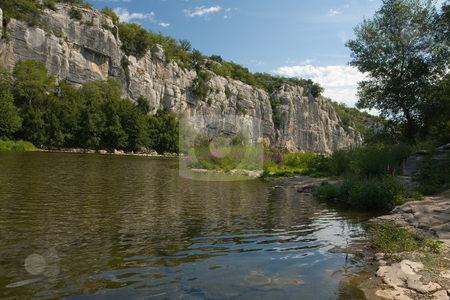 To use this stock image in your creative project, please select the size you need over to the right and click the "Add to Cart" button.
Your downloaded image will come with the Cutcaster watermark removed so don’t worry about the watermark you see on this page. Body of water and Cliffs in Chassezac, Ardeche Valley stock photo, Der Chassezac ist ein Zufluss der Ard?che in S?dfrankreich. Er entspringt in den Cevennen in der N?he von Le Moure de la Gardille. Bei Ruoms m?ndet er in die Ard?che. Typisch ist das steile Tal, welcher in den Jahrtausenden in den Stein gegraben hat. Fluss und Tal sind heute ein Eldorado f?r Kletterer und Kanufahrer. by Wolfgang Heidasch