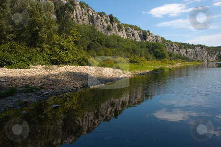 To use this stock image in your creative project, please select the size you need over to the right and click the "Add to Cart" button.
Your downloaded image will come with the Cutcaster watermark removed so don’t worry about the watermark you see on this page. Body of water and Cliffs in Chassezac, Ardeche Valley, Southern France stock photo, Der Chassezac ist ein Zufluss der Ard?che in S?dfrankreich. Er entspringt in den Cevennen in der N?he von Le Moure de la Gardille. Bei Ruoms m?ndet er in die Ard?che. Typisch ist das steile Tal, welcher in den Jahrtausenden in den Stein gegraben hat. Fluss und Tal sind heute ein Eldorado f?r Kletterer und Kanufahrer. by Wolfgang Heidasch