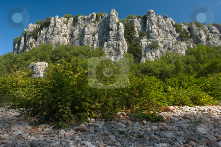 To use this stock image in your creative project, please select the size you need over to the right and click the "Add to Cart" button.
Your downloaded image will come with the Cutcaster watermark removed so don’t worry about the watermark you see on this page. Cliffs in Chassezac, Ardeche Valley, Southern France stock photo, Der Chassezac ist ein Zufluss der Ard?che in S?dfrankreich. Er entspringt in den Cevennen in der N?he von Le Moure de la Gardille. Bei Ruoms m?ndet er in die Ard?che. Typisch ist das steile Tal, welcher in den Jahrtausenden in den Stein gegraben hat. Fluss und Tal sind heute ein Eldorado f?r Kletterer und Kanufahrer. by Wolfgang Heidasch
