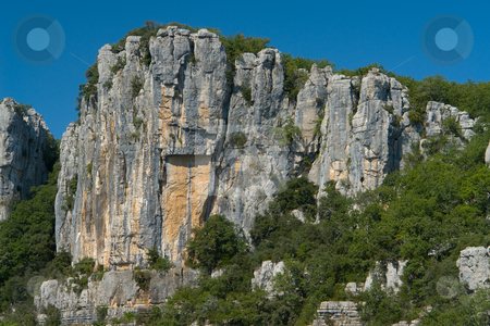To use this stock image in your creative project, please select the size you need over to the right and click the "Add to Cart" button.
Your downloaded image will come with the Cutcaster watermark removed so don’t worry about the watermark you see on this page. Cliffs and trees in Chassezac, Ardeche Valley, Southern France stock photo, Der Chassezac ist ein Zufluss der Ard?che in S?dfrankreich. Er entspringt in den Cevennen in der N?he von Le Moure de la Gardille. Bei Ruoms m?ndet er in die Ard?che. Typisch ist das steile Tal, welcher in den Jahrtausenden in den Stein gegraben hat. Fluss und Tal sind heute ein Eldorado f?r Kletterer und Kanufahrer. by Wolfgang Heidasch