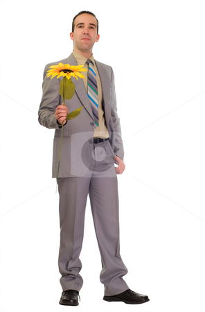 To use this stock image in your creative project, please select the size you need over to the right and click the "Add to Cart" button.
Your downloaded image will come with the Cutcaster watermark removed so don’t worry about the watermark you see on this page. Poor Businessman Gives Fake Flower stock photo, Full body view of a businessman holding a fake flower because he is too poor to buy real ones in a bad economy by Richard Nelson