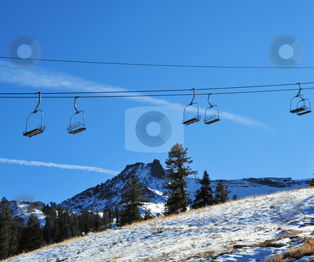 To use this stock image in your creative project, please select the size you need over to the right and click the "Add to Cart" button.
Your downloaded image will come with the Cutcaster watermark removed so don’t worry about the watermark you see on this page. Empty Ski Lift stock photo, Ski lift in the California Sierra's at late Autumn waiting for winter show by Lynn Bendickson