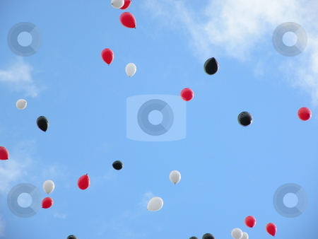 To use this stock image in your creative project, please select the size you need over to the right and click the "Add to Cart" button.
Your downloaded image will come with the Cutcaster watermark removed so don’t worry about the watermark you see on this page. Soaring balloons stock photo, Red, white, and black balloons soaring in the sky by Rob Wright