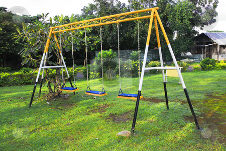 To use this stock image in your creative project, please select the size you need over to the right and click the "Add to Cart" button.
Your downloaded image will come with the Cutcaster watermark removed so don’t worry about the watermark you see on this page. Swing stock photo, Three seat swing in a childrens playground by Jonas Marcos San Luis
