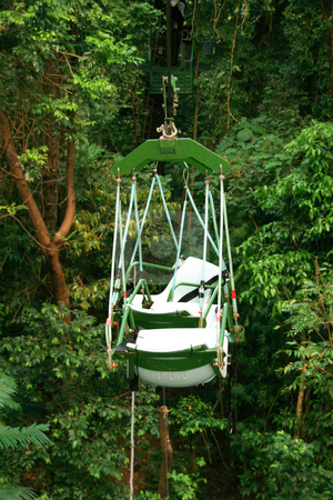 To use this stock image in your creative project, please select the size you need over to the right and click the "Add to Cart" button.
Your downloaded image will come with the Cutcaster watermark removed so don’t worry about the watermark you see on this page. Cable seats stock photo, Empty cable seats in a nature theme park by Jonas Marcos San Luis