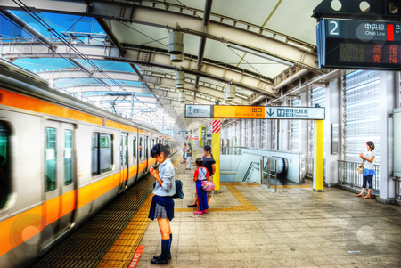 To use this stock image in your creative project, please select the size you need over to the right and click the "Add to Cart" button.
Your downloaded image will come with the Cutcaster watermark removed so don’t worry about the watermark you see on this page. Tokyo Train Station stock photo, Station in Tokyo, Japan. by Josh Smith