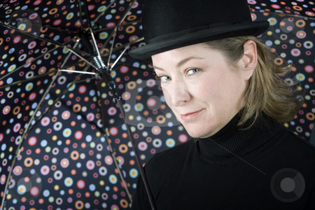To use this stock image in your creative project, please select the size you need over to the right and click the "Add to Cart" button.
Your downloaded image will come with the Cutcaster watermark removed so don’t worry about the watermark you see on this page. Woman in a bowler hat with umbrella stock photo, Woman in bowler hat with spotted umbrella by Scott Griessel