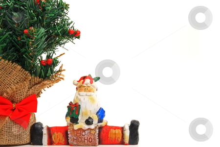 To use this stock image in your creative project, please select the size you need over to the right and click the "Add to Cart" button.
Your downloaded image will come with the Cutcaster watermark removed so don’t worry about the watermark you see on this page. Merry Christmas stock photo, Christmas tree and santa ornamints by Jack Schiffer