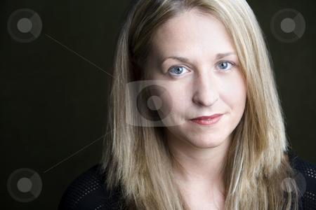 To use this stock image in your creative project, please select the size you need over to the right and click the "Add to Cart" button.
Your downloaded image will come with the Cutcaster watermark removed so don’t worry about the watermark you see on this page. Pretty Blonde Woman stock photo, Portrait of pretty blonde woman on a dark background by Scott Griessel