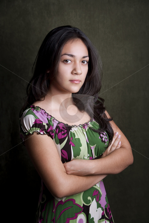 To use this stock image in your creative project, please select the size you need over to the right and click the "Add to Cart" button.
Your downloaded image will come with the Cutcaster watermark removed so don’t worry about the watermark you see on this page. Sterh Hispanic Girl stock photo, Hispanic girl with arms folded and stern expression by Scott Griessel