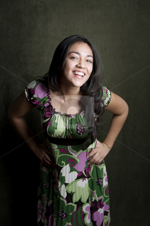 To use this stock image in your creative project, please select the size you need over to the right and click the "Add to Cart" button.
Your downloaded image will come with the Cutcaster watermark removed so don’t worry about the watermark you see on this page. Laughing Hispanic Girl stock photo, Hispanic girl with bright expression on her face by Scott Griessel