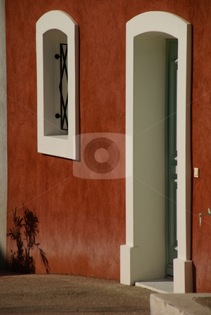 To use this stock image in your creative project, please select the size you need over to the right and click the "Add to Cart" button.
Your downloaded image will come with the Cutcaster watermark removed so don’t worry about the watermark you see on this page. Shadow plant stock photo, A contemporary mediterranean red doorway in the evening light, with a plant pot shadow against the wall. by Tim Green