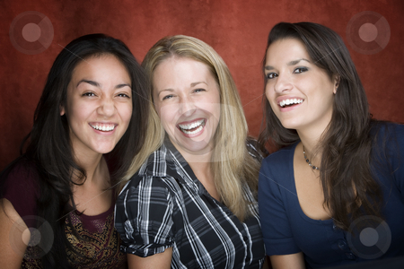 To use this stock image in your creative project, please select the size you need over to the right and click the "Add to Cart" button.
Your downloaded image will come with the Cutcaster watermark removed so don’t worry about the watermark you see on this page. Three Laughing Women stock photo, Three pretty women laughing in a studio setting by Scott Griessel