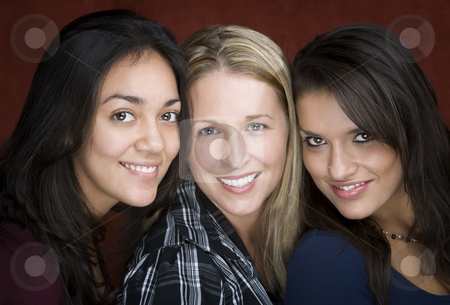 To use this stock image in your creative project, please select the size you need over to the right and click the "Add to Cart" button.
Your downloaded image will come with the Cutcaster watermark removed so don’t worry about the watermark you see on this page. Three Smiling Women stock photo, Three smiling young women in a studio setting by Scott Griessel