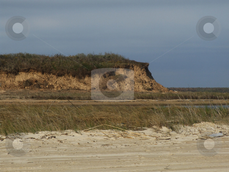 To use this stock image in your creative project, please select the size you need over to the right and click the "Add to Cart" button.
Your downloaded image will come with the Cutcaster watermark removed so don’t worry about the watermark you see on this page. Eroded Sand Dune stock photo, Sand Dune eroded due to Hurricane. The outcropping is what is left of a massive sand dune. by Marburg