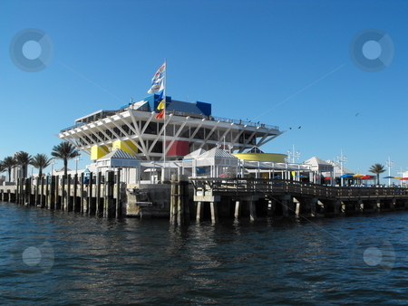 To use this stock image in your creative project, please select the size you need over to the right and click the "Add to Cart" button.
Your downloaded image will come with the Cutcaster watermark removed so don’t worry about the watermark you see on this page. St. Pete's Pier on Tampa Bay stock photo, St. Pete's Pier in St. Petersburg, Fl on Tampa Bay is a popular tourist destination and get-away. Visitors to The Pier have access to a variety of shops, the Pier Aquarium, carriage rides, live entertainment, and The Pier Bait Shop with numerous Pelicans. by Dennis Thomsen