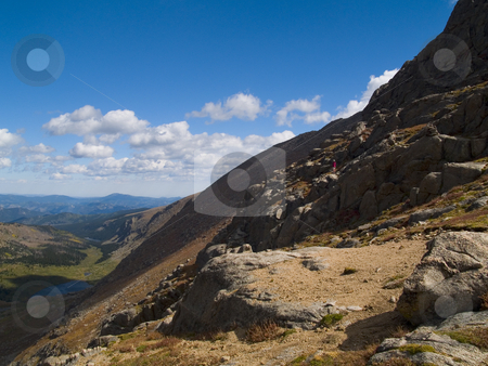 To use this stock image in your creative project, please select the size you need over to the right and click the "Add to Cart" button.
Your downloaded image will come with the Cutcaster watermark removed so don’t worry about the watermark you see on this page. The View stock photo, A hiker at the Chicago Lakes Basin in the Mt. Evans Wilderness, Colorado. by John McLaird