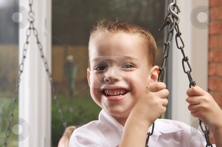 To use this stock image in your creative project, please select the size you need over to the right and click the "Add to Cart" button.
Your downloaded image will come with the Cutcaster watermark removed so don’t worry about the watermark you see on this page. Adorable Young Boy Smiles stock photo, Adorable Young Boy with Blue Eyes Smiles for the Camera by Andy Dean