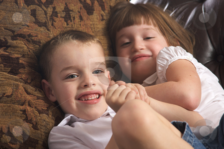 To use this stock image in your creative project, please select the size you need over to the right and click the "Add to Cart" button.
Your downloaded image will come with the Cutcaster watermark removed so don’t worry about the watermark you see on this page. Brother and Sister Having Fun stock photo, Brother and Sister Having Fun on the Couch by Andy Dean