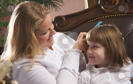 To use this stock image in your creative project, please select the size you need over to the right and click the "Add to Cart" button.
Your downloaded image will come with the Cutcaster watermark removed so don’t worry about the watermark you see on this page. Young Mother and Daughter stock photo, Young Mother and Daughter Enjoying a Personal Moment by Andy Dean