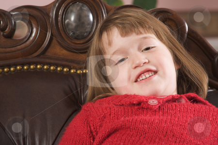 To use this stock image in your creative project, please select the size you need over to the right and click the "Add to Cart" button.
Your downloaded image will come with the Cutcaster watermark removed so don’t worry about the watermark you see on this page. Adorable Girl Poses stock photo, Adorable Girl Poses for a Fun Portrait on a Leather Chair by Andy Dean