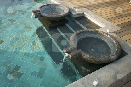 To use this stock image in your creative project, please select the size you need over to the right and click the "Add to Cart" button.
Your downloaded image will come with the Cutcaster watermark removed so don’t worry about the watermark you see on this page. Exotic Pool Fountains stock photo, Exotic Pool Fountains, Tiled Pool and Steps by Andy Dean