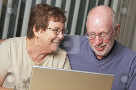To use this stock image in your creative project, please select the size you need over to the right and click the "Add to Cart" button.
Your downloaded image will come with the Cutcaster watermark removed so don’t worry about the watermark you see on this page. Senior Adults on Laptop Computer stock photo, Senior Adults on Working on a Laptop Computer by Andy Dean