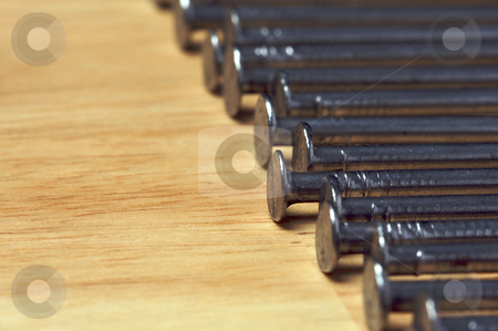 To use this stock image in your creative project, please select the size you need over to the right and click the "Add to Cart" button.
Your downloaded image will come with the Cutcaster watermark removed so don’t worry about the watermark you see on this page. Macro of Nails on Wood stock photo, Macro of Nails on a Wood Background. by Andy Dean