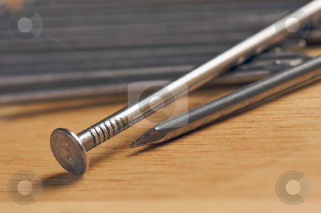 To use this stock image in your creative project, please select the size you need over to the right and click the "Add to Cart" button.
Your downloaded image will come with the Cutcaster watermark removed so don’t worry about the watermark you see on this page. Macro of Nails on Wood stock photo, Macro of Nails on a Wood Background. by Andy Dean