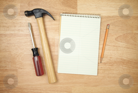To use this stock image in your creative project, please select the size you need over to the right and click the "Add to Cart" button.
Your downloaded image will come with the Cutcaster watermark removed so don’t worry about the watermark you see on this page. Pad of Paper, Pencil, Hammer and Screwdriver stock photo, Pad of Paper, Pencil, Hammer and Screwdriver on a Wood Background. by Andy Dean