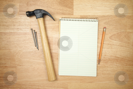 To use this stock image in your creative project, please select the size you need over to the right and click the "Add to Cart" button.
Your downloaded image will come with the Cutcaster watermark removed so don’t worry about the watermark you see on this page. Pad of Paper, Pencil, Hammer and Nails stock photo, Pad of Paper, Pencil, Hammer and Nails on a Wood Background. by Andy Dean