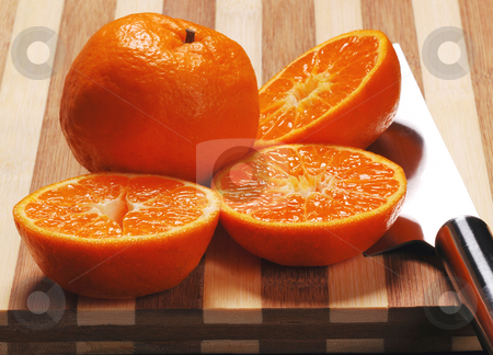 To use this stock image in your creative project, please select the size you need over to the right and click the "Add to Cart" button.
Your downloaded image will come with the Cutcaster watermark removed so don’t worry about the watermark you see on this page. Oranges sliced stock photo, by Francesco Perre