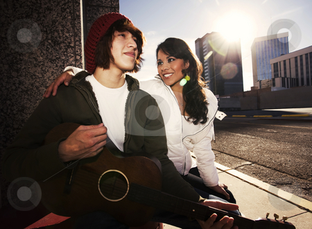 To use this stock image in your creative project, please select the size you need over to the right and click the "Add to Cart" button.
Your downloaded image will come with the Cutcaster watermark removed so don’t worry about the watermark you see on this page. Musician and Pretty Girlfriend Downtown stock photo, Hispanic musician and Latina Girlfriend downtown at sundown by Scott Griessel