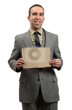 To use this stock image in your creative project, please select the size you need over to the right and click the "Add to Cart" button.
Your downloaded image will come with the Cutcaster watermark removed so don’t worry about the watermark you see on this page. Businessman Holding Cardboard Sign stock photo, A smiling businessman isolated against a white background, holding a small cardboard sign by Richard Nelson