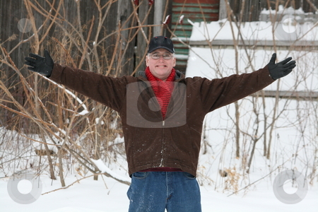 To use this stock image in your creative project, please select the size you need over to the right and click the "Add to Cart" button.
Your downloaded image will come with the Cutcaster watermark removed so don’t worry about the watermark you see on this page. Welcoming Man, Winter stock photo, A happy man, with his arms outstretched in a warm welcome, on a cold winter day by Tom and Beth Pulsipher
